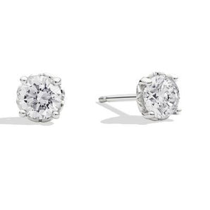 Anniversary, orecchini punto luce in oro bianco 18 Kt e diamante taglio brillante Ct. 0,20