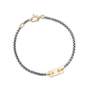 Bracciale in titanio con piastrina
e moschettone in oro giallo
con incisione maschietto e
femminuccia